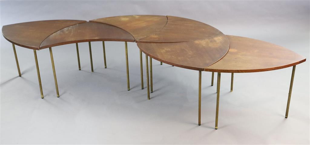 Peter Huidt and Orla Malgaard-Neilson for France & Son. A Danish teak and brass pinwheel modular table in six leaf form sections, c.1